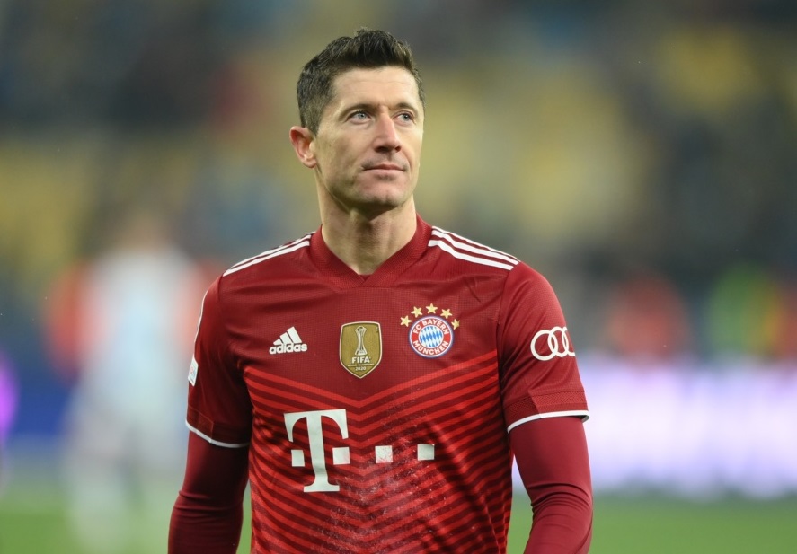 Robert Lewandowski holding ball, modern striker image