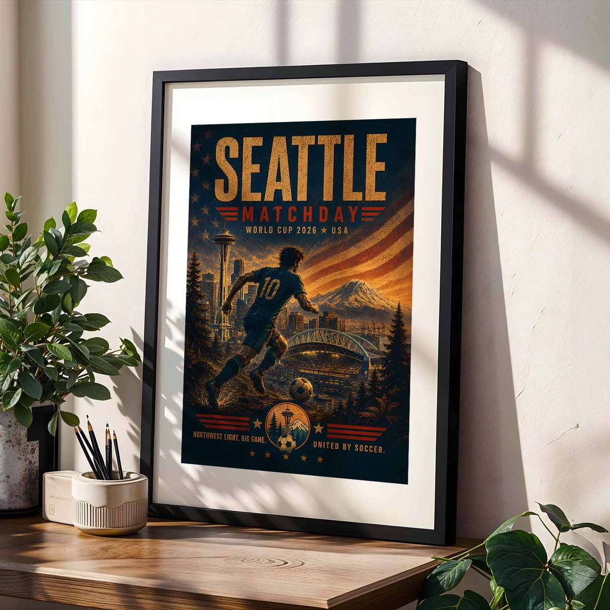 Seattle skyline reflecting on the waterfront at night with subtle World Cup iconography